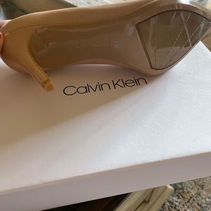 Brand new Calvin Klein pumps. Beautiful shoes, just to high heel for me.